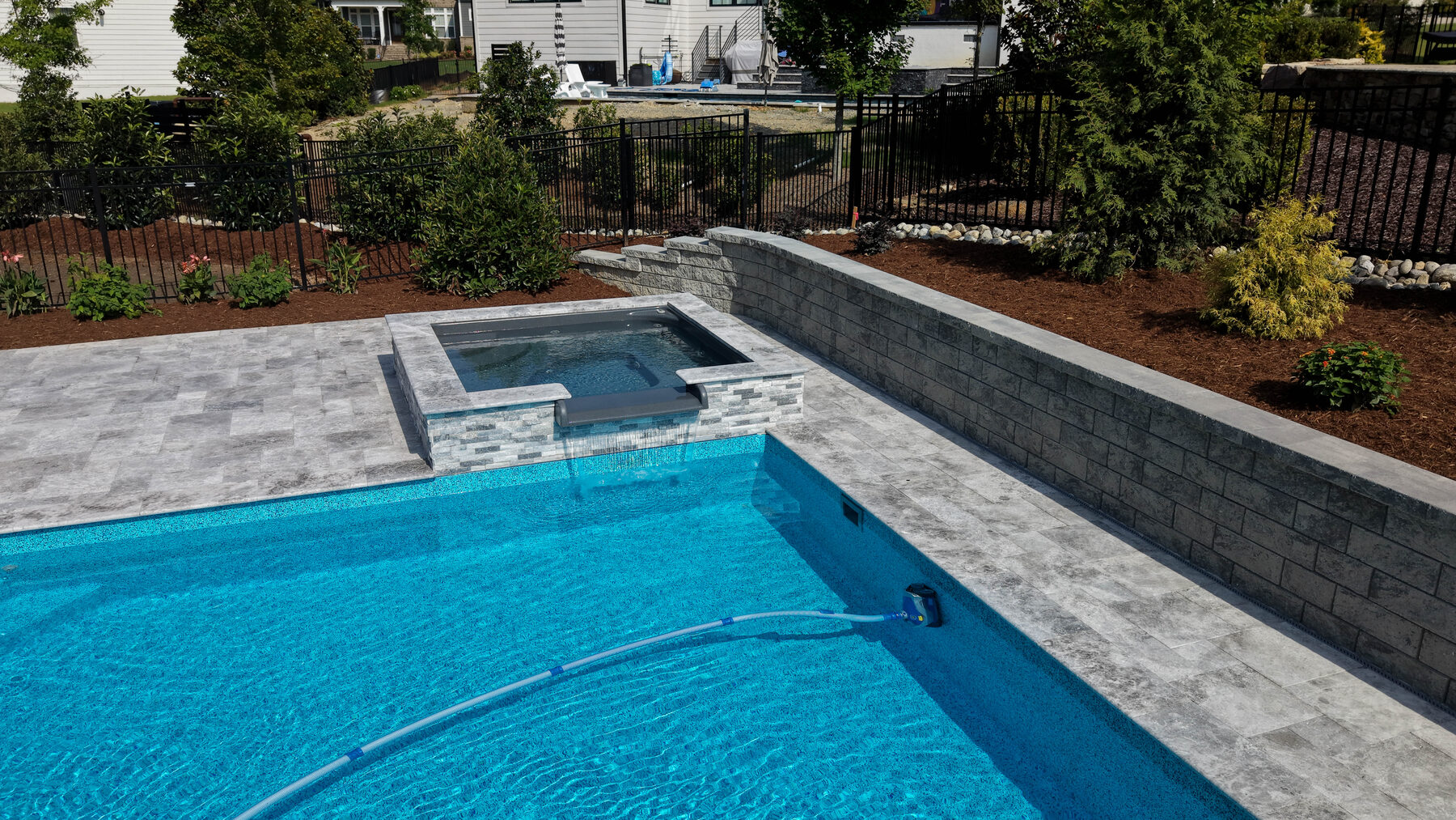 Pool and spa with block wall