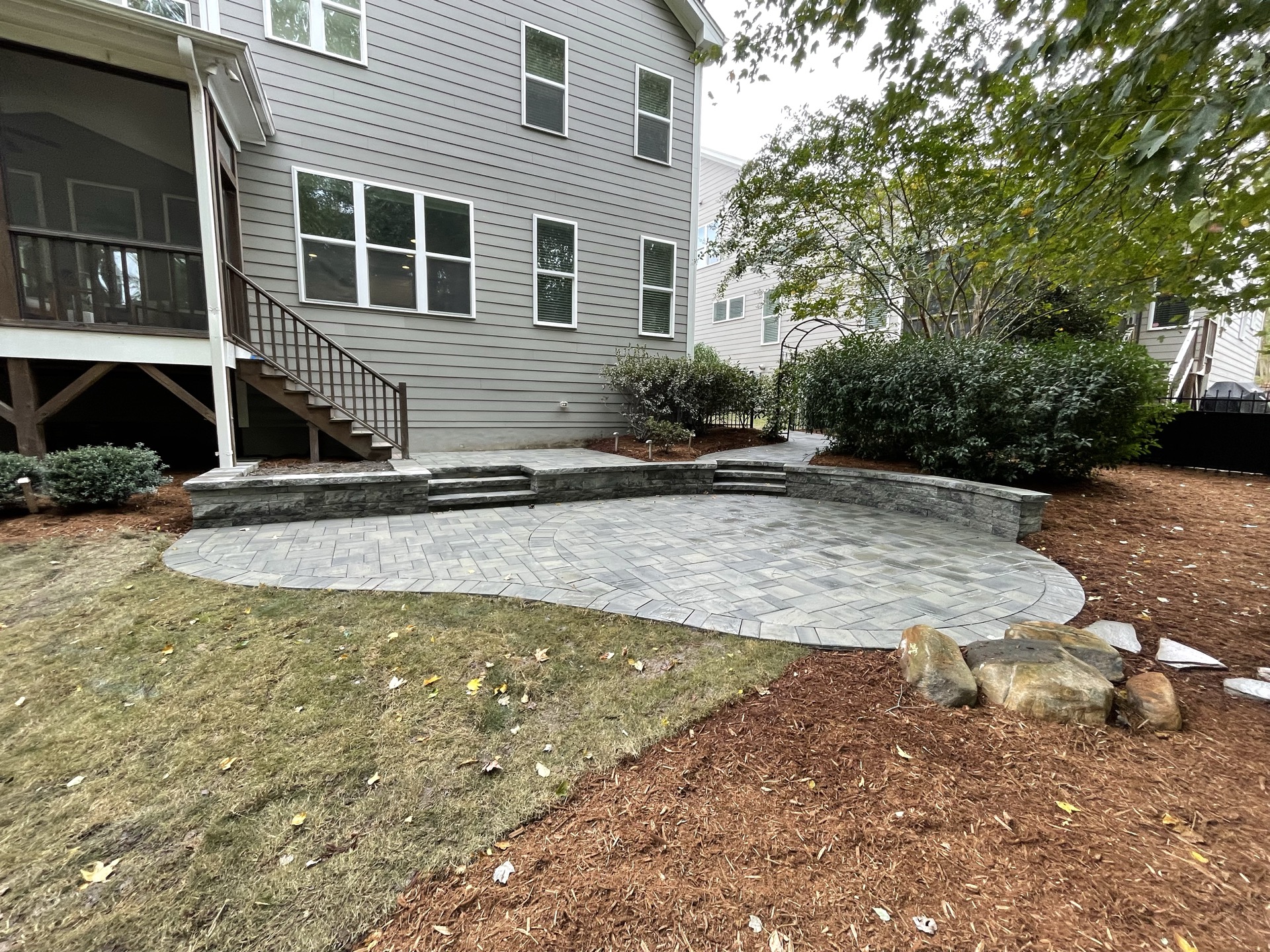 Backyard patio with seating wall